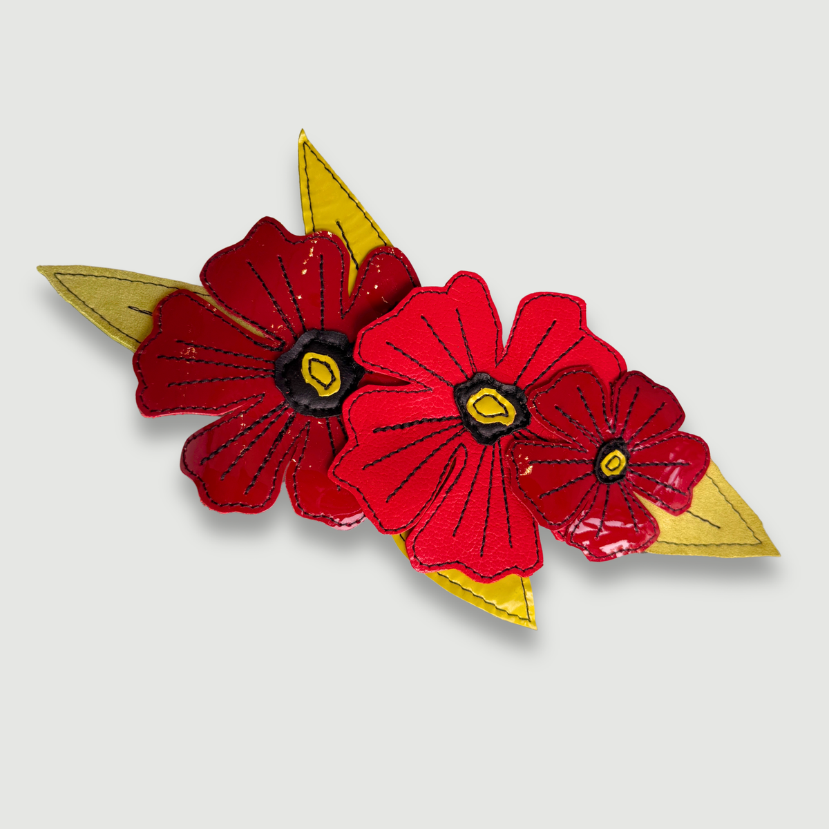 the leather poppies brooch