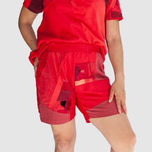 Load image into Gallery viewer, red short on model made by zero waste daniel a sustainable fashion brand in ny
